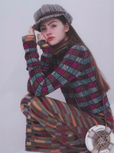 Em Marie in striped sweater and hat